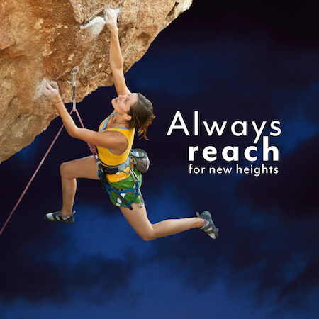 Visual of a woman rock climbing.